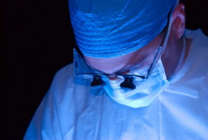 Surgeon with magnifying lenses